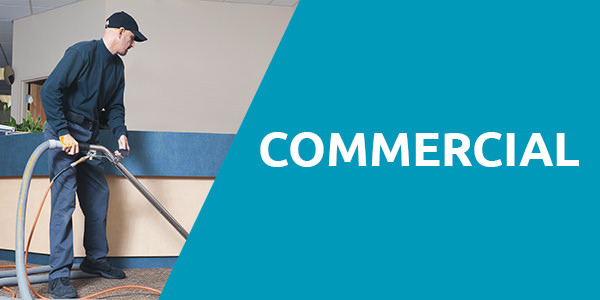 Xtreme Clean NM Services - Commercial Carpet Cleaning in Albuquerque Man wearing a cleaning uniform with a black hat is cleaning the carpet with a steam carpet cleaner with a header title that says "Commercial" with blue background and that is one of the services of carpet cleaning Albuquerque.